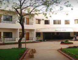 Haritha Hotel building in Kadapa city with parking in front