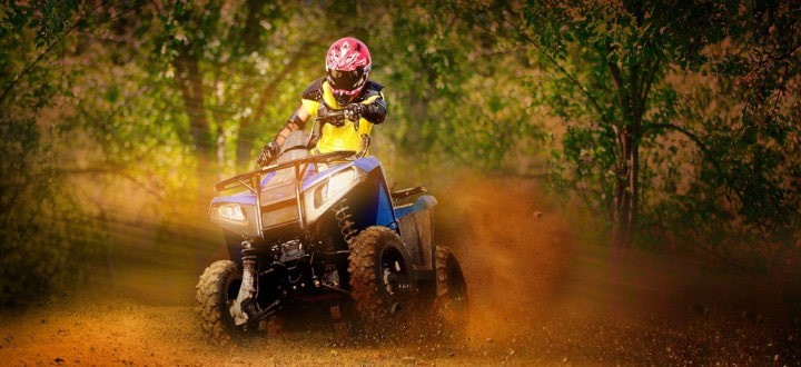 Rider in helmet and safety gear on an ATV quad bike at Sahas, Ramoji Film City