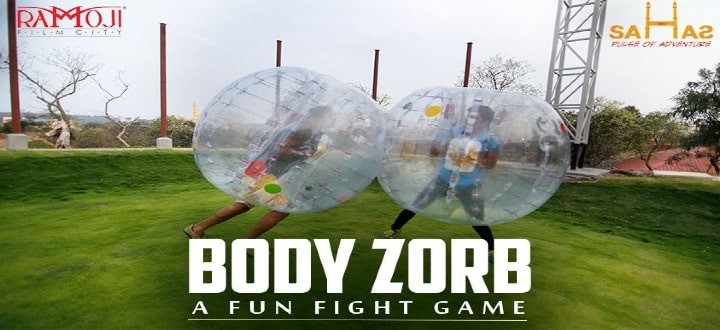 Players in inflatable zorb bubbles bumping into each other at Sahas