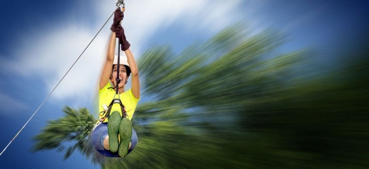 Participant crossing obstacles on the high rope course at Sahas Ramoji