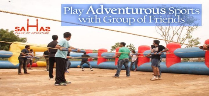 Teams holding ropes and playing human foosball at Sahas Ramoji