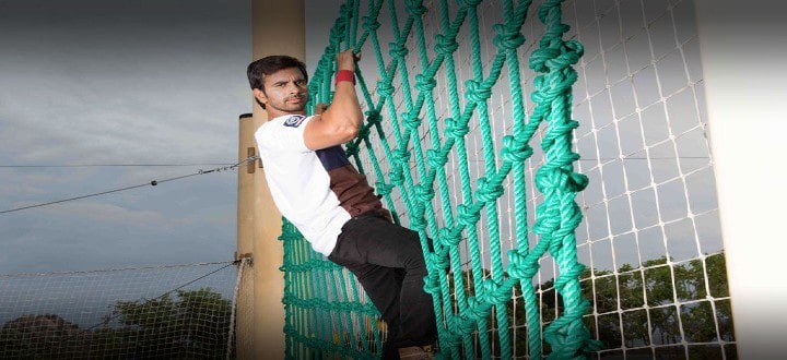 Children and adults climbing the giant net course at Sahas Ramoji