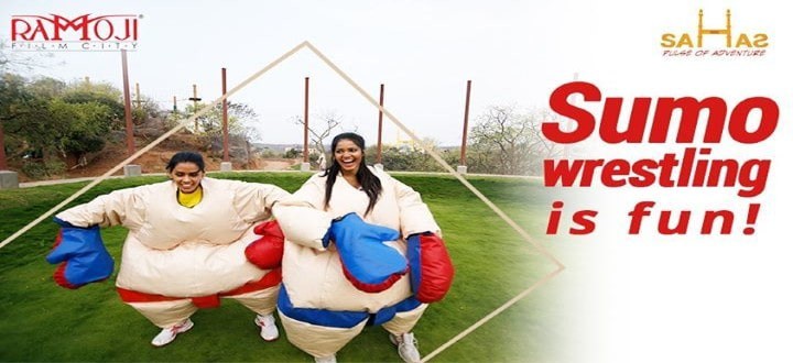 Two friends wrestling in giant sumo suits at Sahas Ramoji Film City